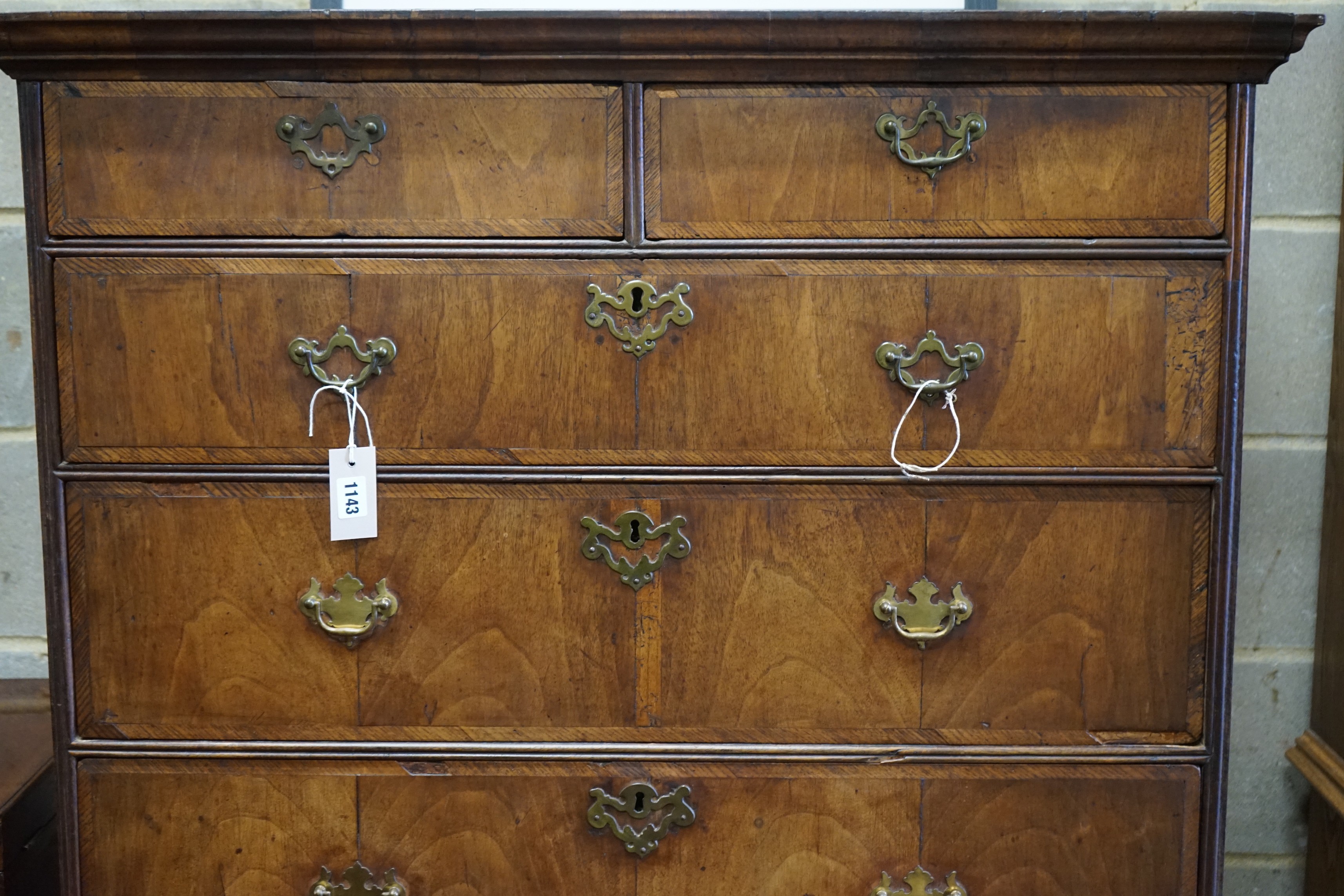 An 18th century banded walnut chest on stand, width 96cm, depth 57cm, height 153cm